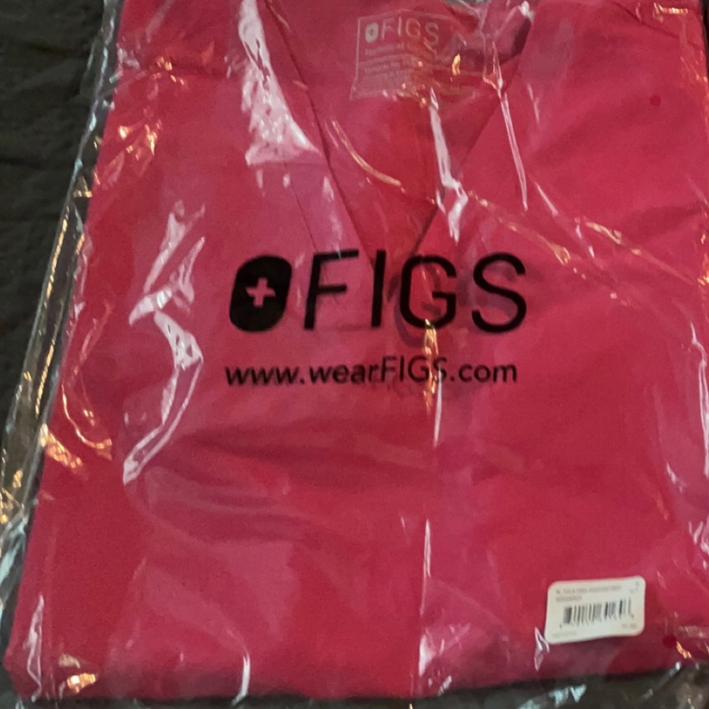 Figs Casma top in shocking pink. Sold out online.